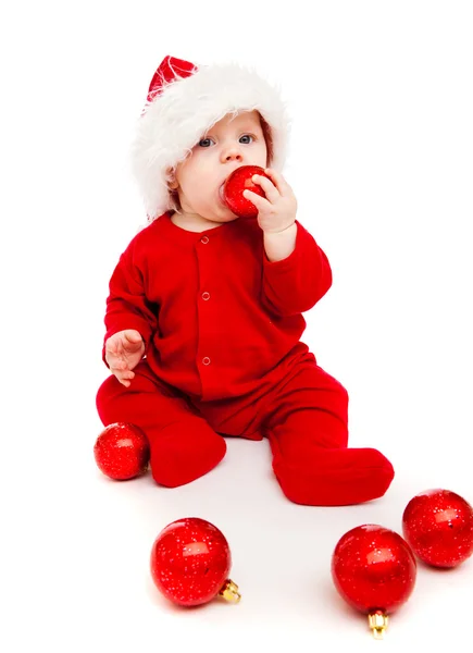 Ребенок с рождественскими яйцами — стоковое фото