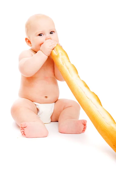Barnet äta franskt bröd — Stockfoto