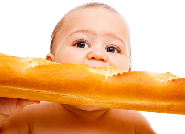 Μωρό τρώει γαλλικό ψωμί — Φωτογραφία Αρχείου