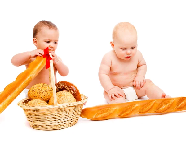 Babies eating bread — Stock Photo, Image