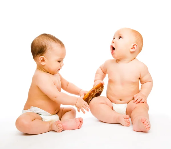 Babies with roll — Stock Photo, Image