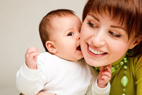 Baby kissing mother — Stock Photo, Image