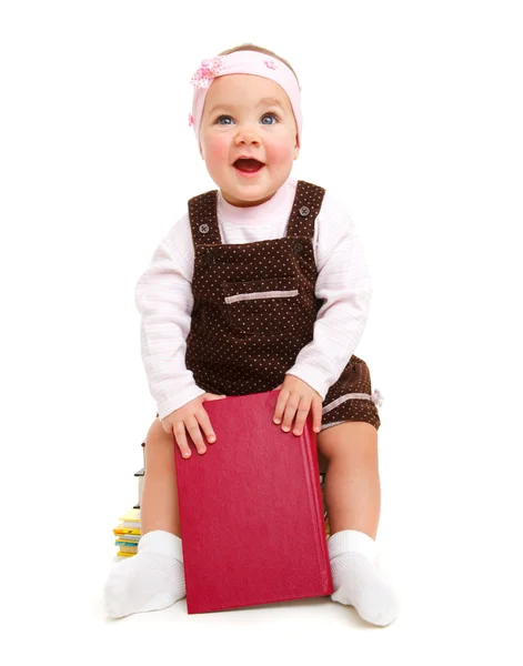 本の上に座って幸せな赤ちゃん — ストック写真