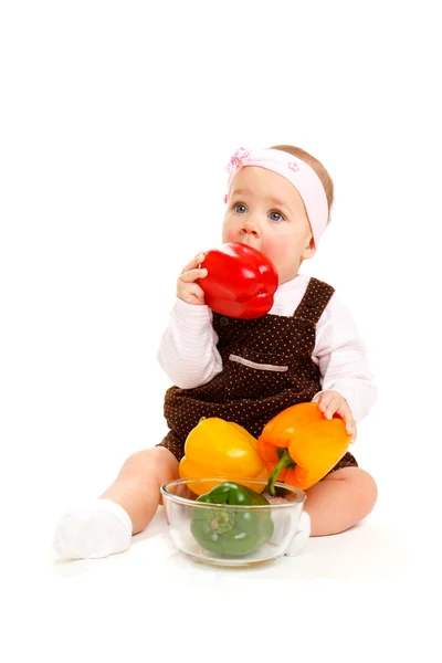 Baby with peppers — Stock Photo, Image