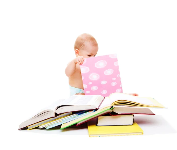 Baby looking into the book — Stock Photo, Image
