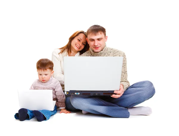 Parents and kid with laptop — Stock Photo, Image