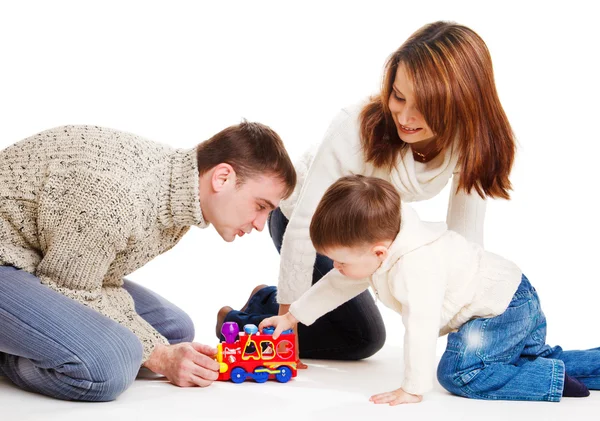 Kind und seine Eltern spielen — Stockfoto