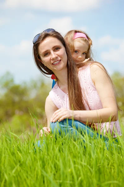 Mother and curly daughter — Stock Photo, Image