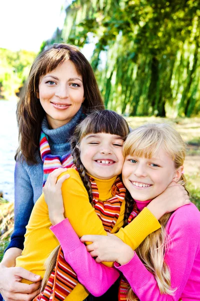 Happy sisters and their mother — Stock Photo, Image