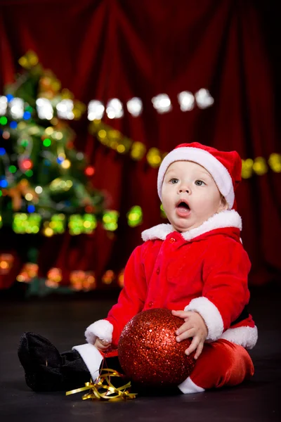 Surprised toddler with Christmas ball — Stock Photo, Image
