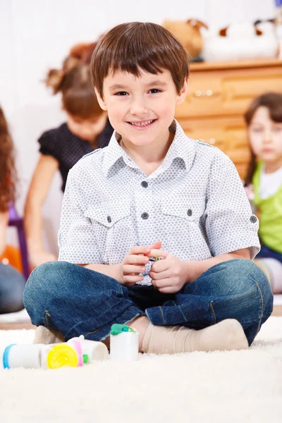 Boy playing with dough — Stock Photo, Image