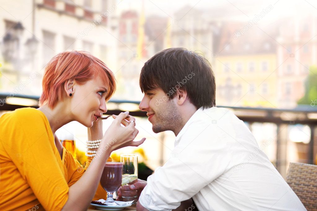 Cute young couple eating lunch