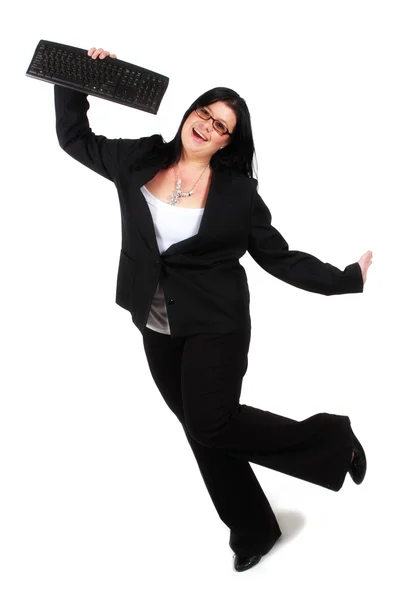 Счастливая женщина прыгает с клавиатурой в руке — стоковое фото