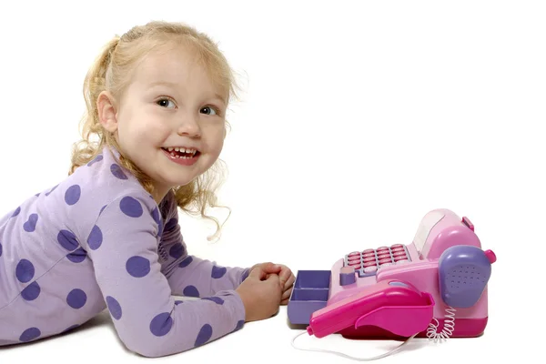 小さな女の子がおもちゃで遊んで — ストック写真