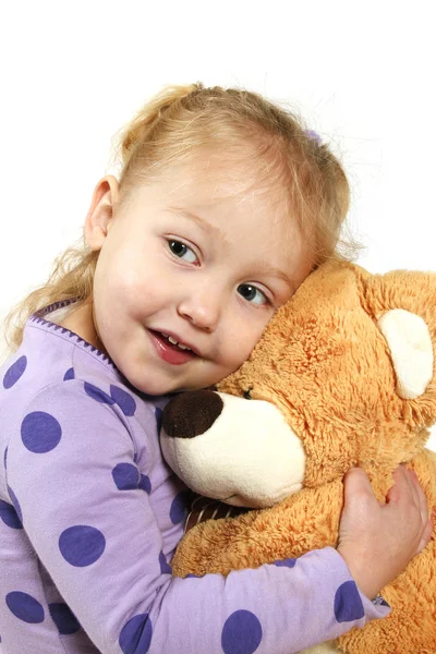 Petite fille étreignant un ours en peluche — Photo