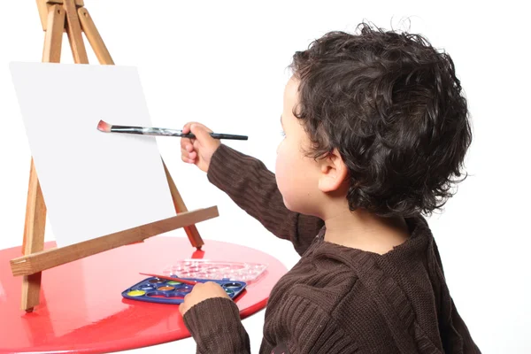 stock image Little boy painting