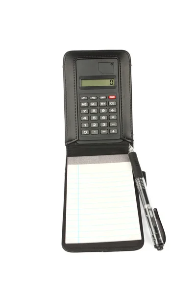 Calculadora con bloc de notas y pluma — Foto de Stock