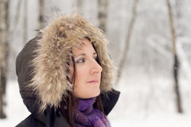 Woman in forest with fur hood clipart