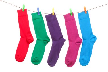 Five different color socks hang on rope clipart