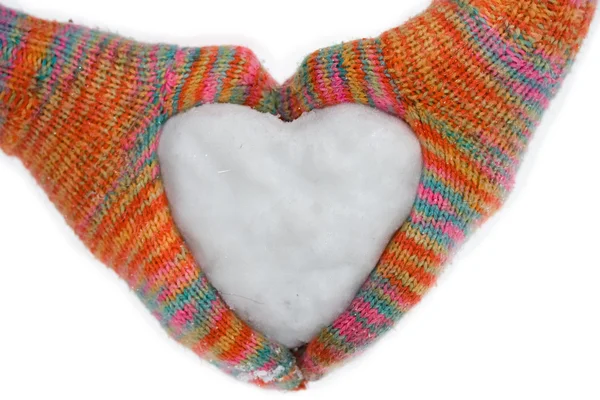 Heart of snow in gloves — Stock Photo, Image