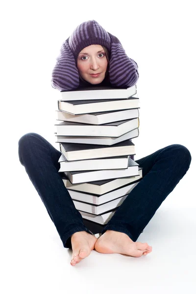 Сумна жінка зі стопкою книг — стокове фото