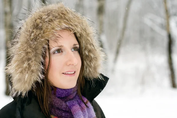Woman in forest with fur hood — Stock Photo, Image