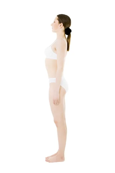 Kobieta stojąc w uderwear na białym tle — Zdjęcie stockowe