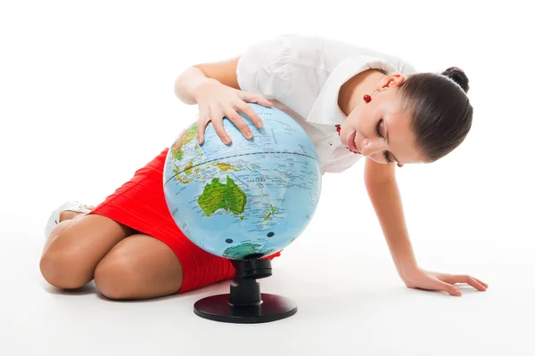 Business woman searching county on the globe — Stock Photo, Image