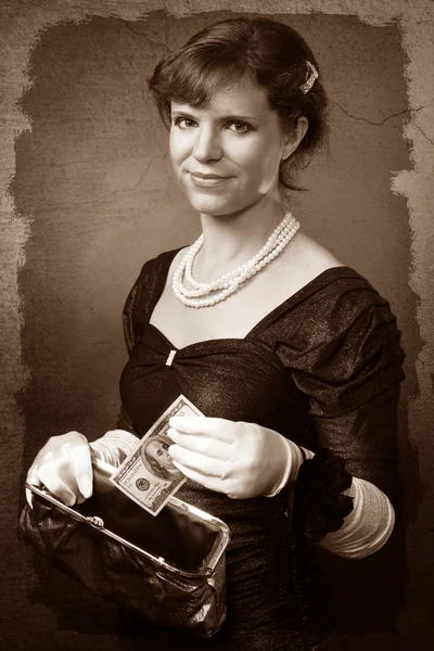 stock image Vintage looking woman with dollar and purse