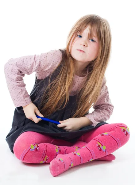 Little girl sit with felt pen with intense face — Stock Photo, Image