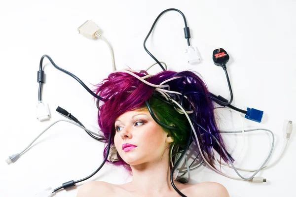 Woman lay on the floor with wires and plugs — Stock Photo, Image