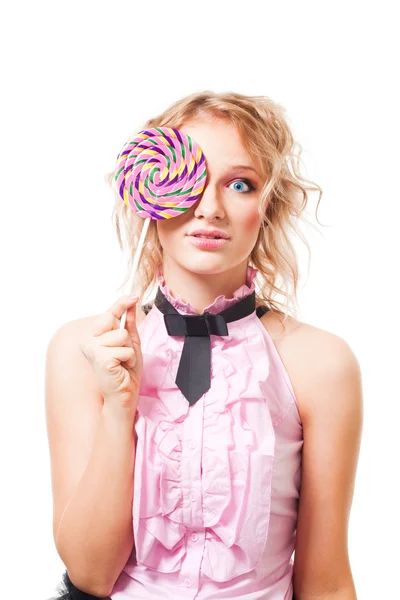 Kvinna med lollipop i rosa klänning — Stockfoto