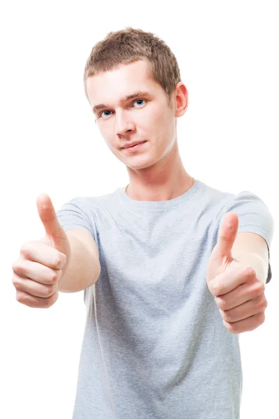 Positive young man with thumbs up — Stock Photo, Image