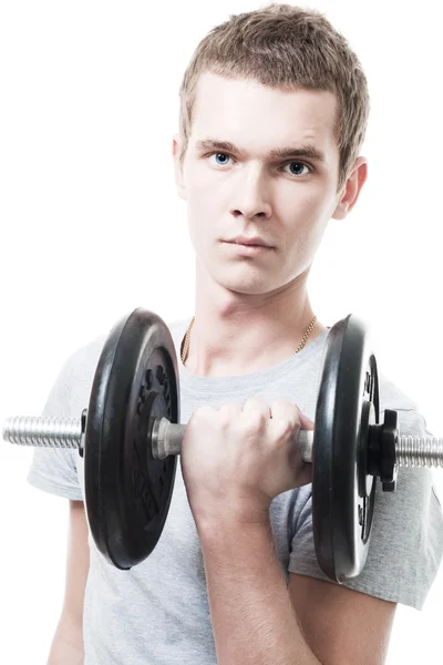 Junger Mann stemmt Gewicht in Turnhalle — Stockfoto