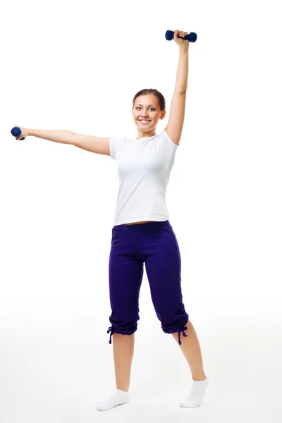 Šťastná mladá žena cvičení s činkami — Stock fotografie