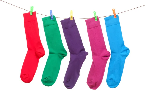 Five different color socks hang on rope — Stock Photo, Image