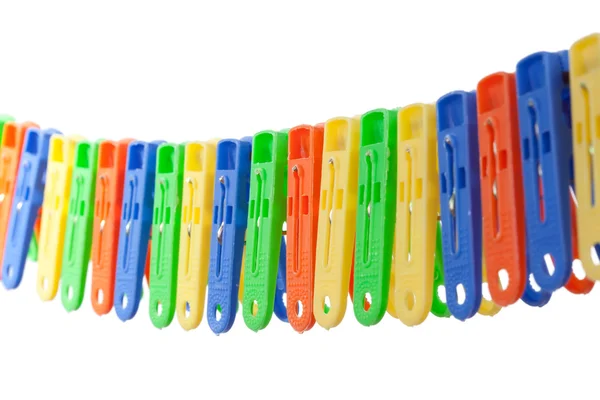 Colorful row of clothes pegs — Stock Photo, Image
