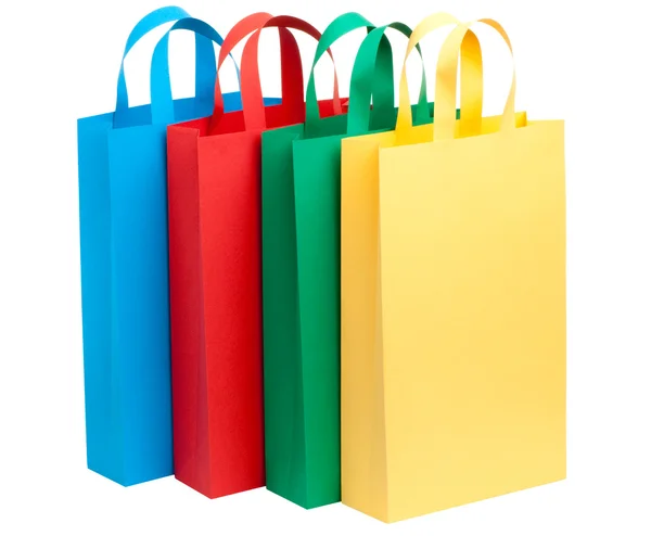 Quatro sacos de papel a cores — Fotografia de Stock