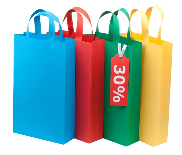 Čtyři barevné nákupní tašky — Stock fotografie