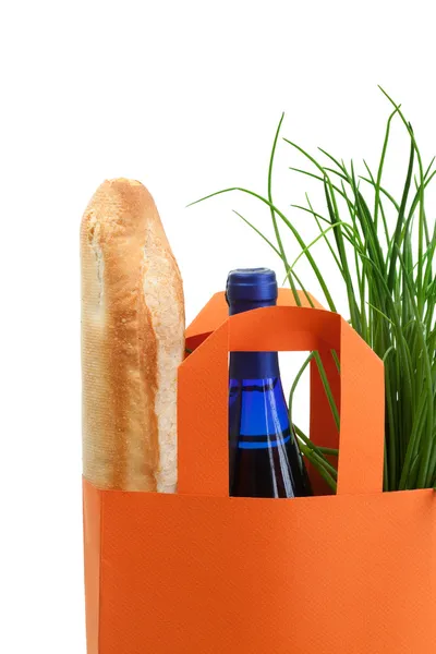 stock image Bag with greens, baguette, and wine bottle