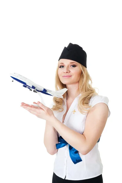 Flugbegleiterin mit Flugzeugmodell — Stockfoto