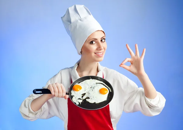 Chef with pan and frying egg — Stock Photo, Image