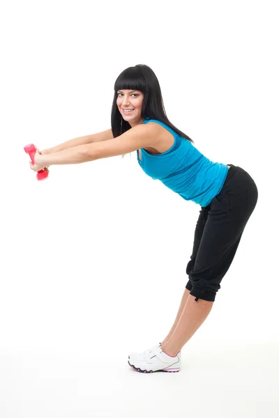 Woman stretching with dumbbells — Stock Photo, Image