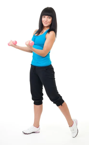 Jonge vrouw doen fitness gebruik van halters — Stockfoto