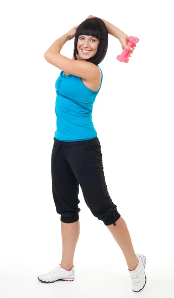 Mujer sonrisa y ejercicio con mancuerna — Foto de Stock