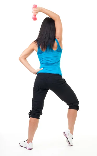Πίσω από την γυναίκα στέκεται και άσκηση με αλτήρα — Φωτογραφία Αρχείου
