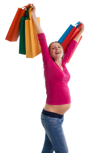 Szczęśliwa kobieta w ciąży z torby na zakupy — Zdjęcie stockowe