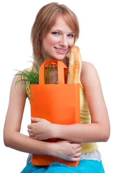 Femme heureuse tenant sac à provisions — Photo