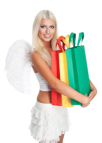 Anděl drží mnoho nákupní tašky — Stock fotografie
