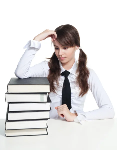 Sad schoolgirl with books — Stock Photo, Image